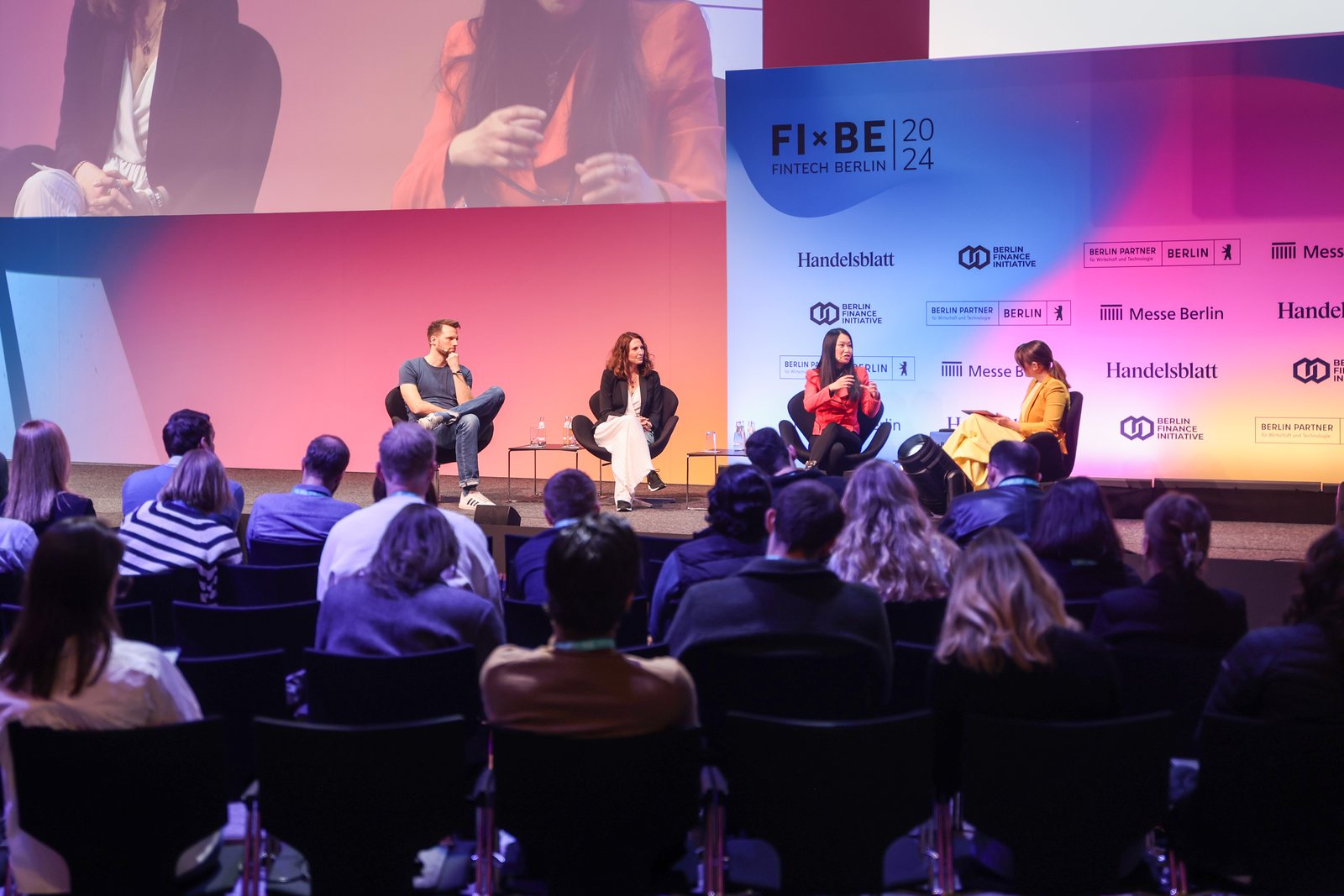 Lesley Li speaking on stage at FIBE Berlin 2024